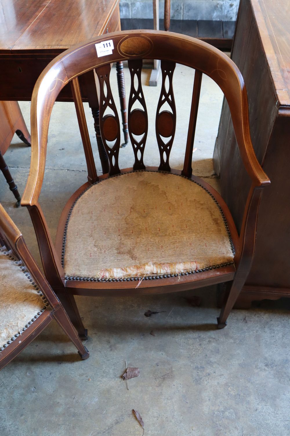 Two Edwardian inlaid mahogany tub shaped elbow chairs and a Victorian walnut salon chair